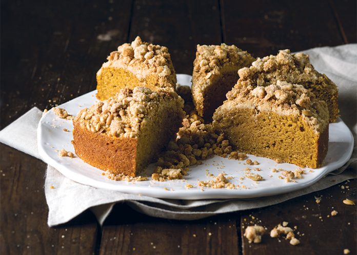 Pumpkin Cake with Browned Butter Streusel on dark surface
