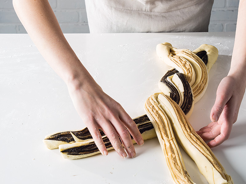Shaping Your Braided Brioche braiding on white surface