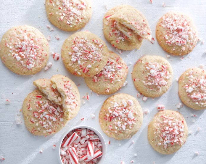 Cream Cheese-Stuffed Vanilla-Peppermint Cookies on white with peppermint sprinkled