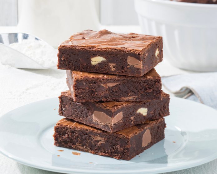 The Ultimate Brownies stacked on white plate