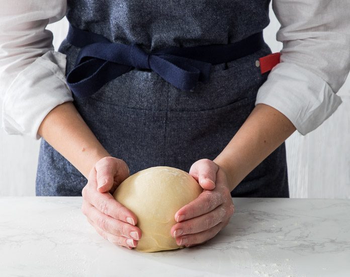 Do-It-All Dough in ball on marble