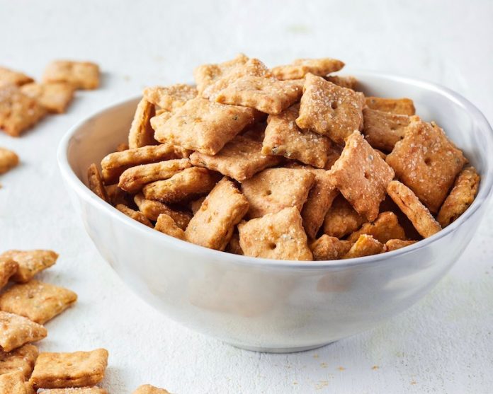 sourdough cheese crackers in a white bowl.