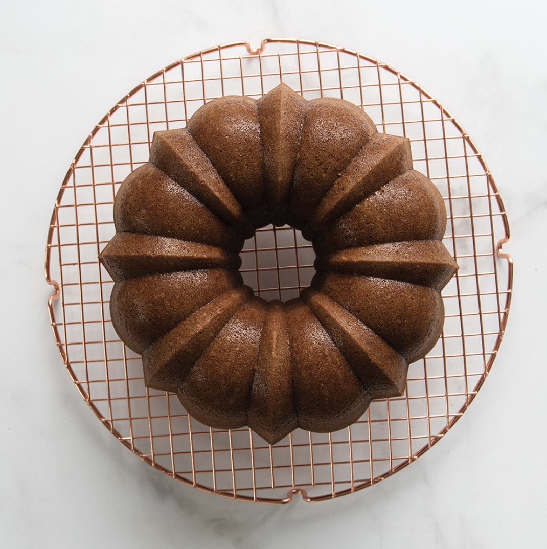 Round Copper Cooling Grid with Bundt Cake on it