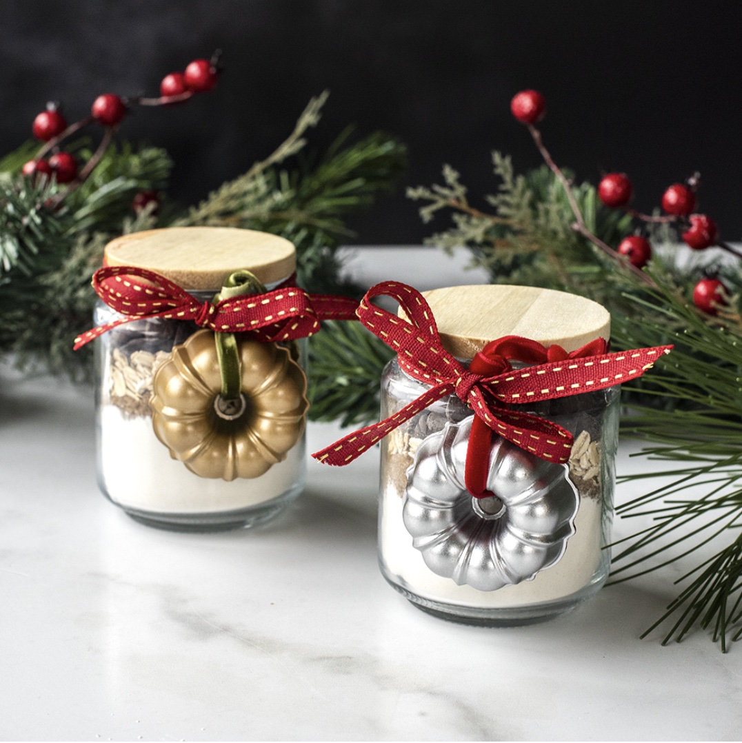 gold and silver bundt ornaments on jars