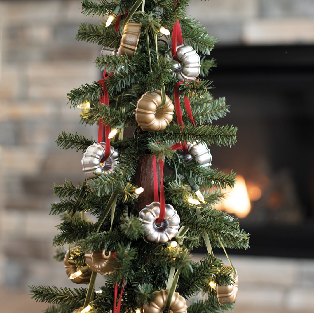 gold and silver bundt ornaments on christmas tree