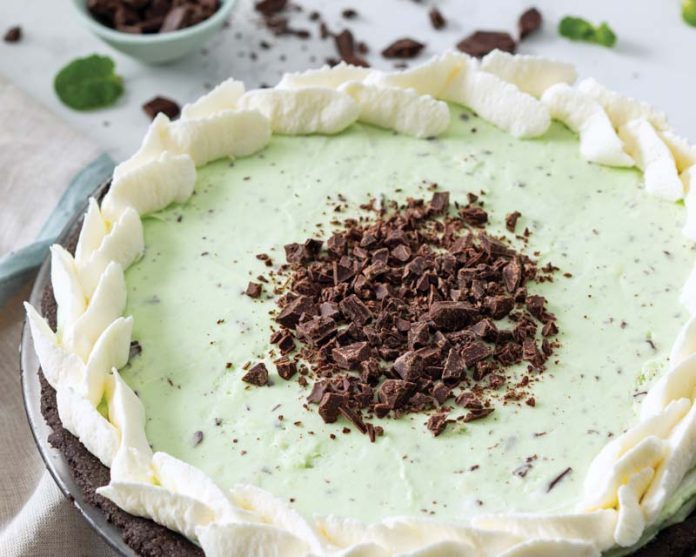 mint chip pie with whipped cream on white background baking recipe